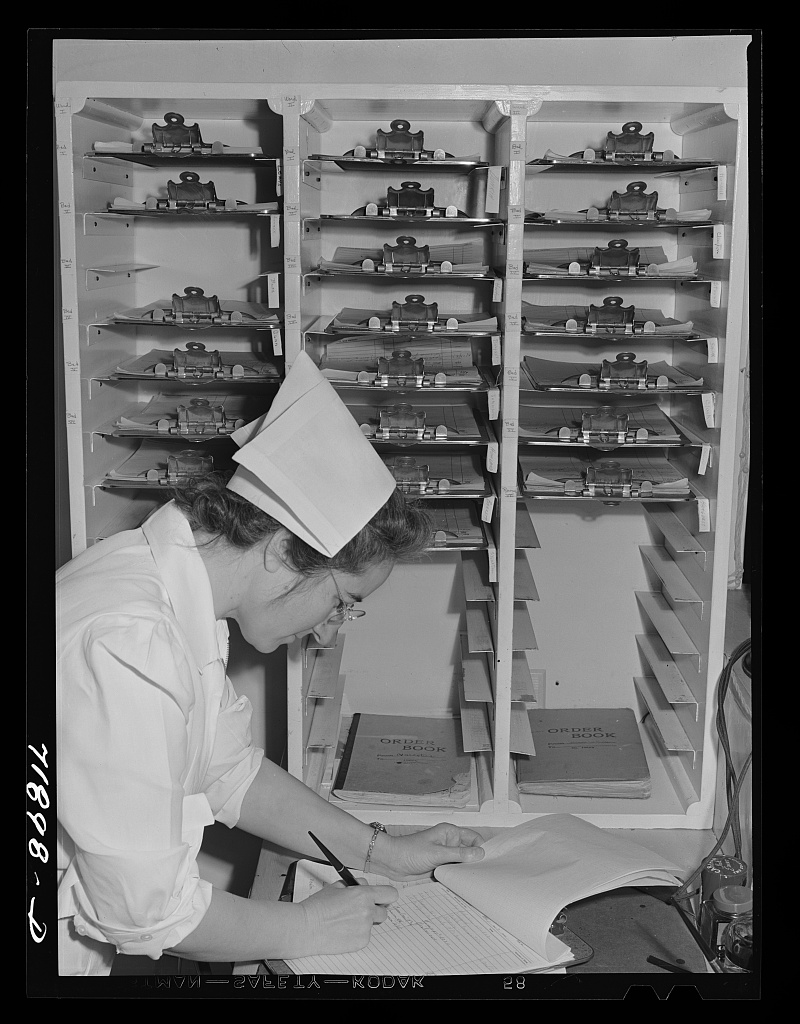The superintendent of nurses writing up a patient chart at an FSA community hospital in Arizona