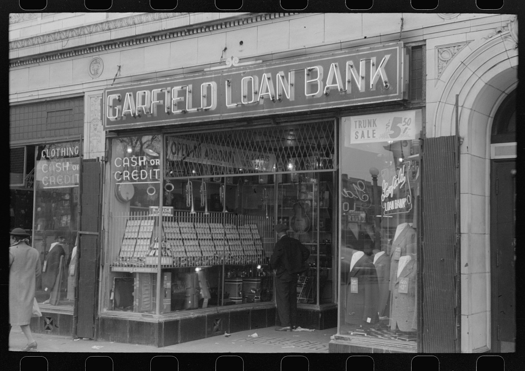 Storefronts of loan banks lining a street on the South Side of Chicago