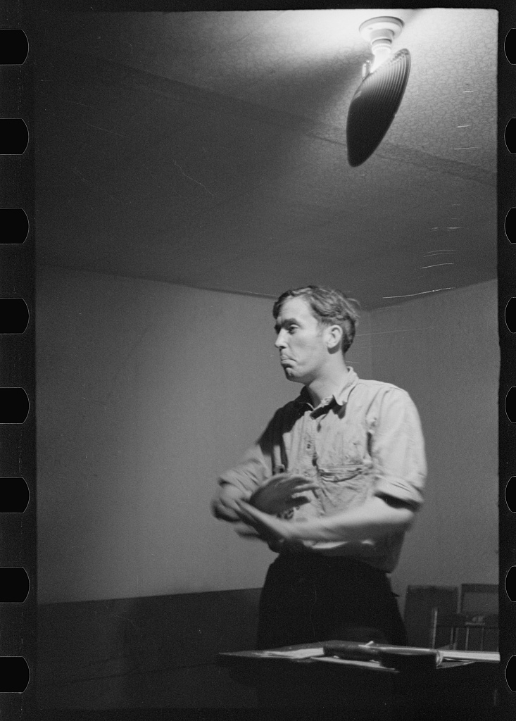 A union organizer addresses agricultural workers at a union meeting in Bridgeton, New Jersey
