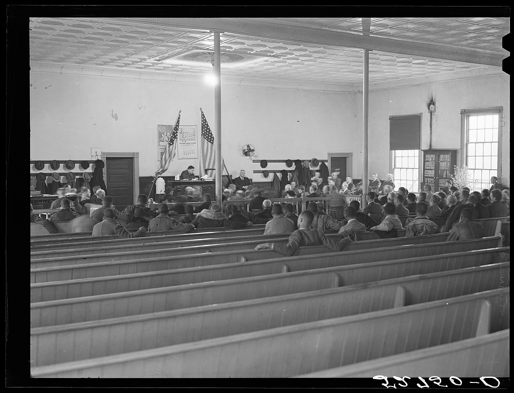The interior of a county courthouse courtroom during an active trial in Oxford, North Carolina