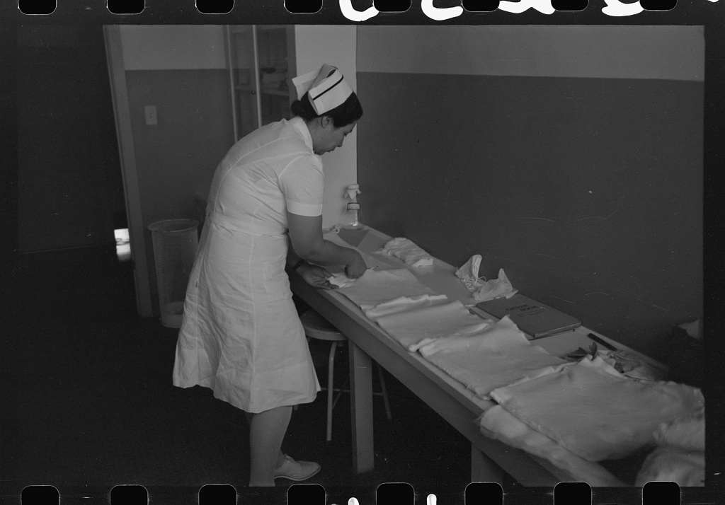 A surgery nurse prepares at the Cairns General Hospital at an FSA farmworkers community in Arizona