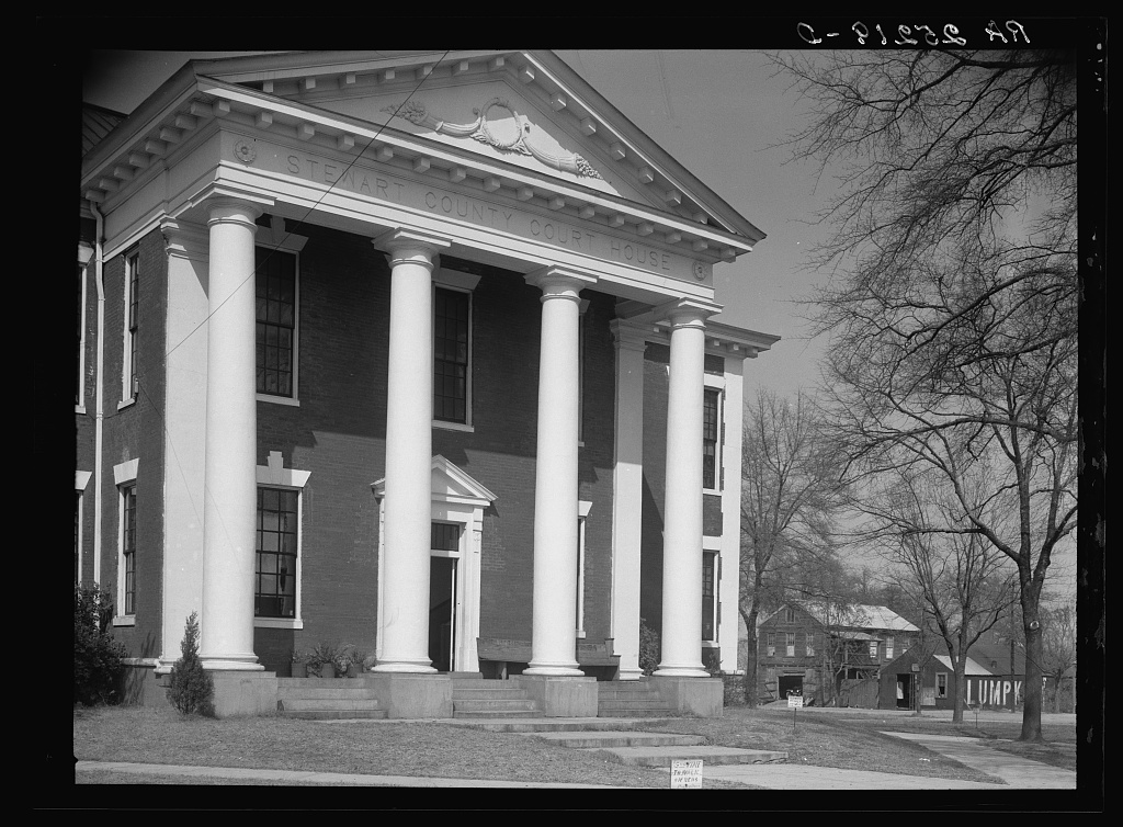 The Stewart County courthouse in Georgia, a columned building on a quiet square