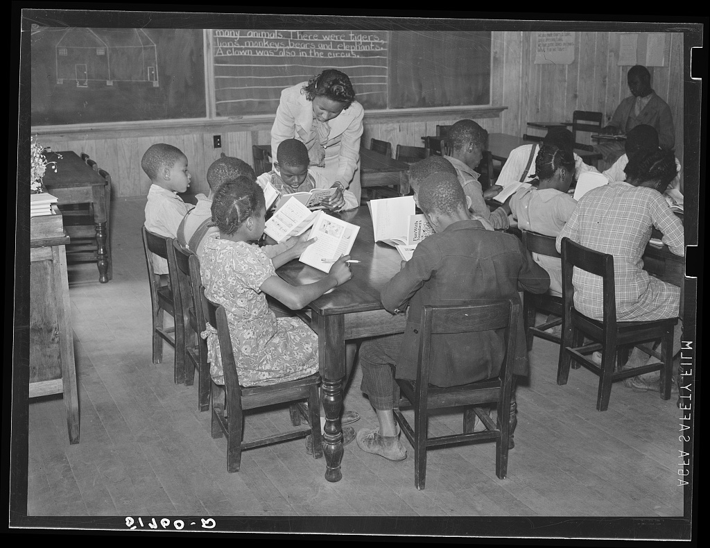 A teacher at the front of a rural classroom in Prairie Farms, Alabama