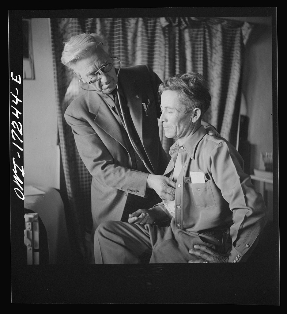 A doctor conducts a medical examination in a rural New Mexico clinic