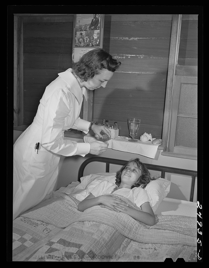 A nurse makes a home visit to a child recovering from pneumonia in a Texas farm workers camp