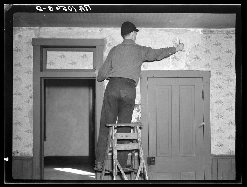Young tenant farmer Clifford Rowe in his just-moved-into home near Templeton, Indiana