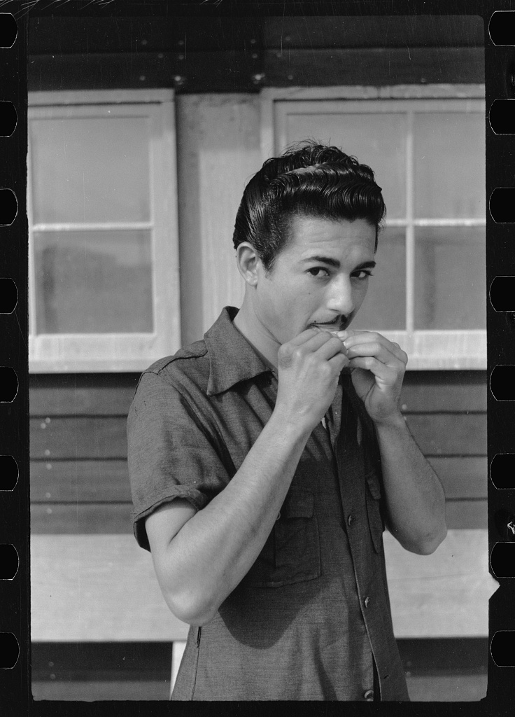A young migratory worker at a Farm Security Administration camp in Sinton, Texas